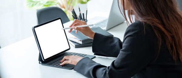 Low angle view of woman working on table