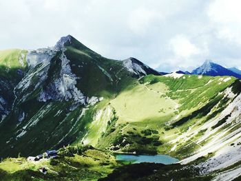 Scenic view of snowcapped mountains against sky