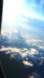 Aerial view of landscape against blue sky