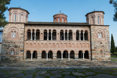 Facade of historic building against sky