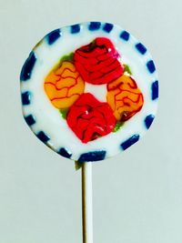 High angle view of candies against white background