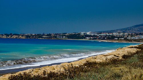 Scenic view of sea against clear blue sky