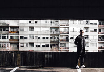 FULL LENGTH OF A MAN STANDING IN CITY