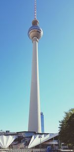 Low angle view of communications tower against sky