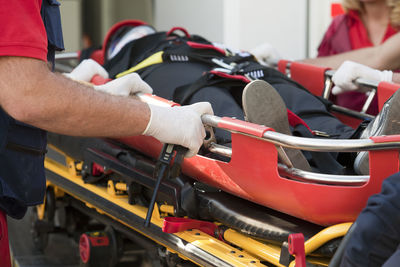 Paramedics carrying patient on stretcher