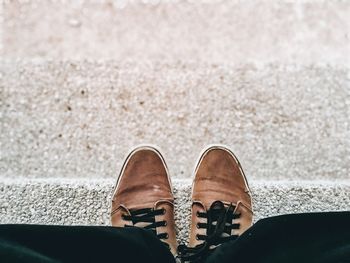 Low section of man standing on steps