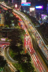 High angle view of light trails on road at night