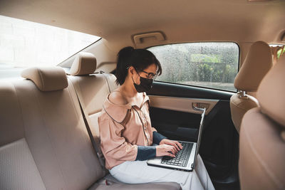 Woman sitting in car