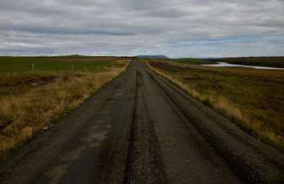 Road amidst landscape against sky