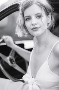 Portrait of beautiful woman in car