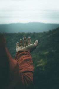 Midsection of person against sky