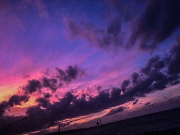 Low angle view of dramatic sky during sunset