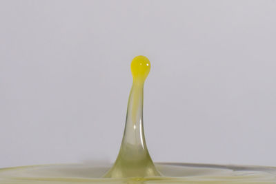 Close-up of drink over white background