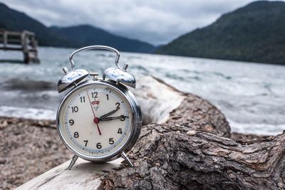 Close-up of clock on rock