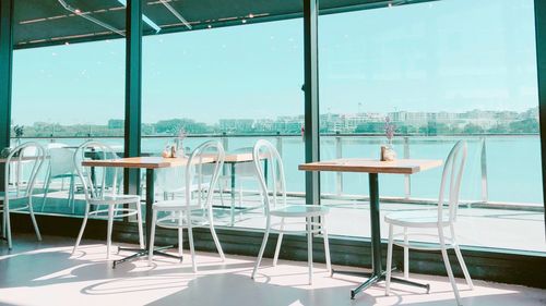 Empty chairs and tables in restaurant