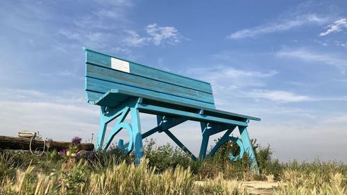 Built structure on field against sky