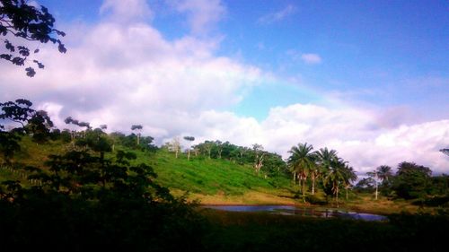 Scenic view of landscape against cloudy sky