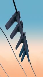  photo is taken standing under a rope for drying clothes against the clear sky