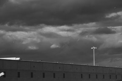 High section of building against cloudy sky