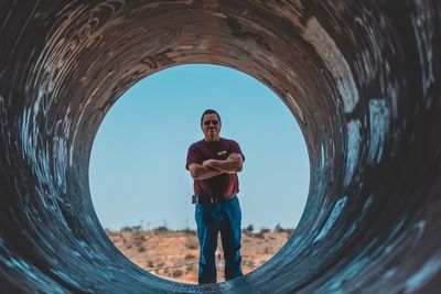 Portrait of man standing in tunnel