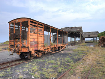 Train on railroad track against sky