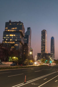 Pink sky sunset in a park viewing the skyline of santiago de chile