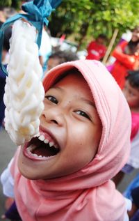 Close-up of young woman cracker eating contest in commemoration of the independence day of indonesia 