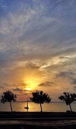 Scenic view of sea against sky at sunset