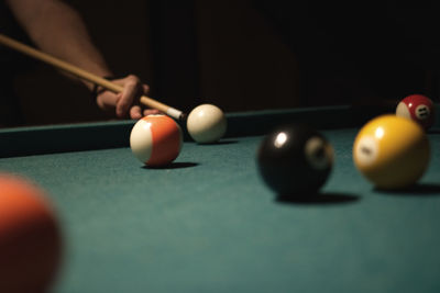 Close-up of person playing snooker