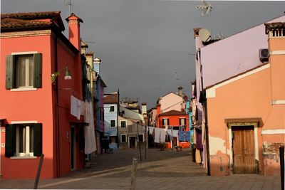 Street amidst buildings in city against sky