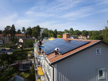 Installation of solar panels on roof of house