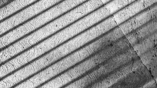 Full frame shot of shadow on tiled floor