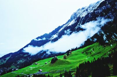 Scenic view of mountains against sky during winter