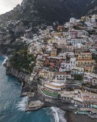 High angle view of townscape by sea