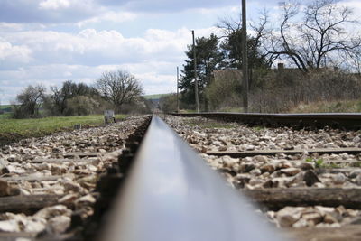 Surface level of railroad track along trees