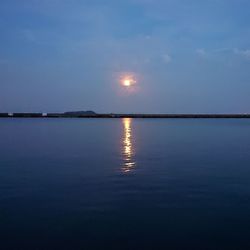 Scenic view of sea against sky at sunset