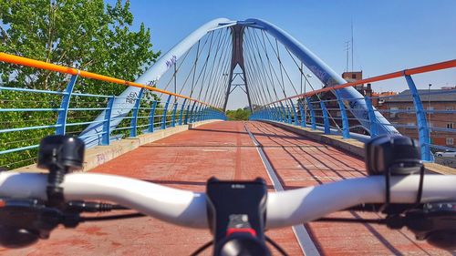 Bridge against sky in city