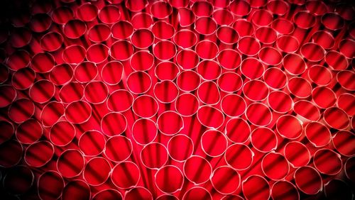 Full frame shot of red drinking straws