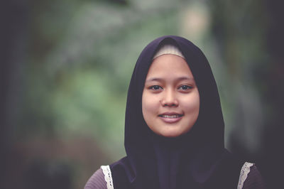 Close-up portrait of young woman wearing hijab