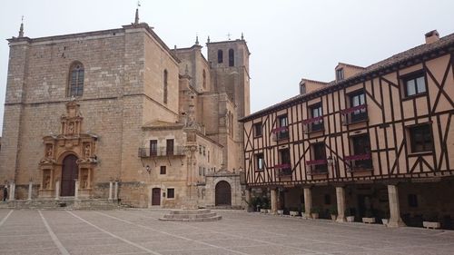 View of historic building in city against clear sky