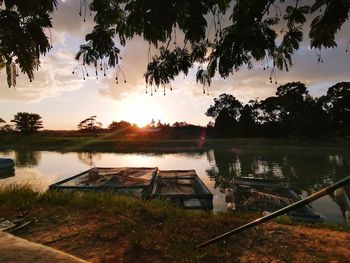 Scenic view of lake against sky during sunset