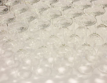 High angle view of wineglasses arranged on table