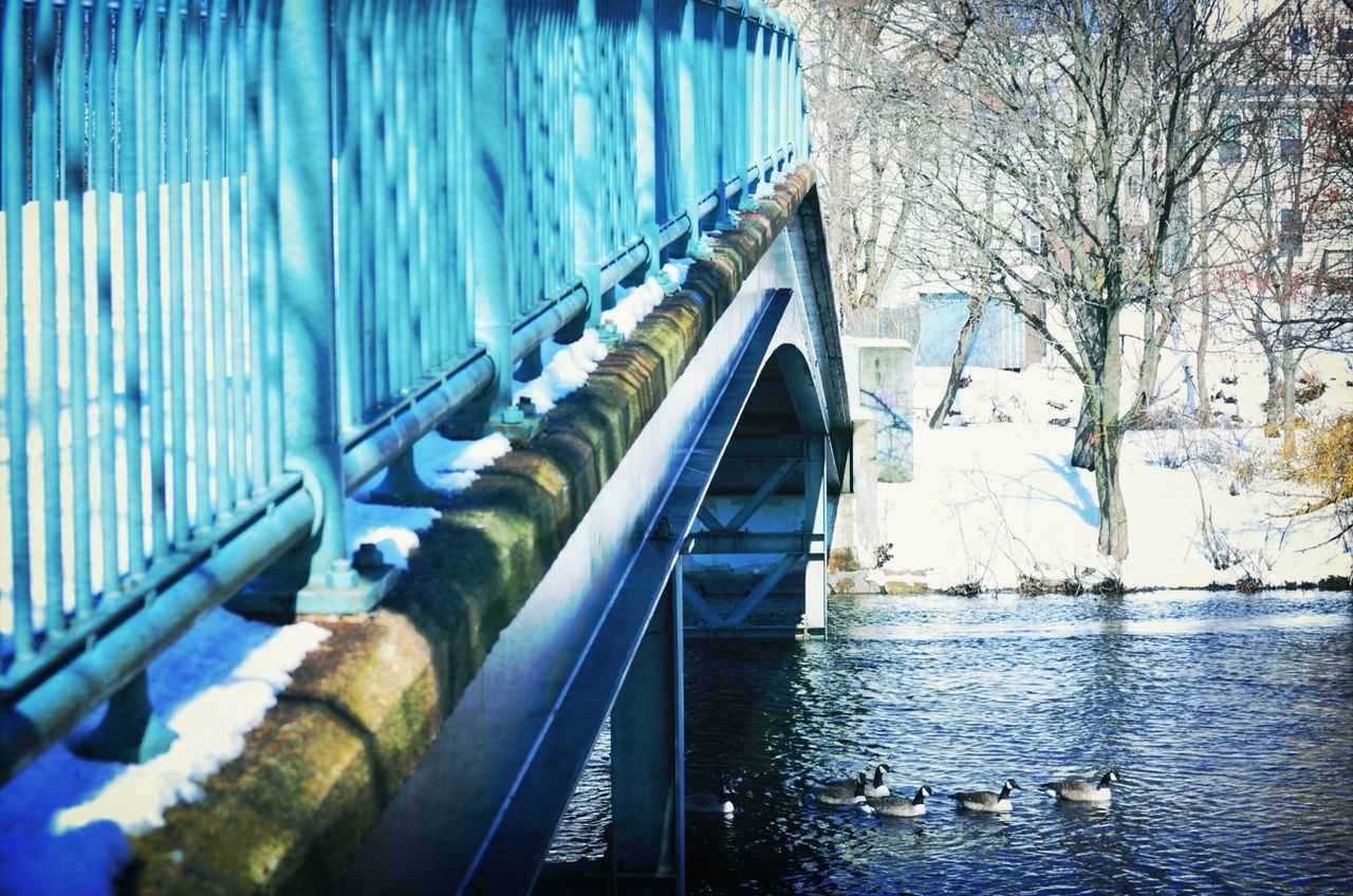 railing, built structure, architecture, water, bridge - man made structure, connection, footbridge, transportation, blue, day, reflection, steps, river, canal, building exterior, the way forward, diminishing perspective, outdoors, no people, metal