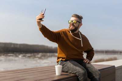 Man taking selfie through smart phone