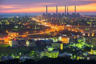 High angle view of illuminated cityscape at night