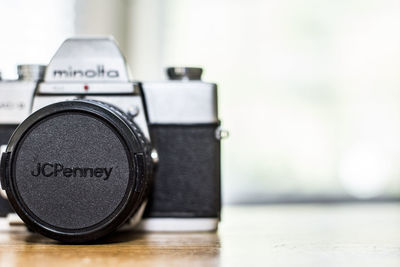 Close-up of camera on table