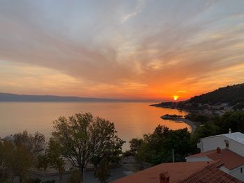 Scenic view of sea against orange sky