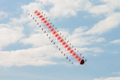 Low angle view of airshow against sky