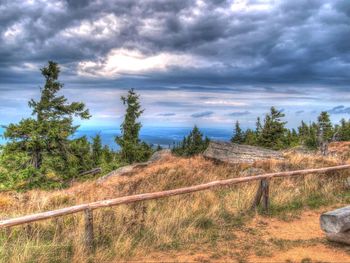 Scenic view of landscape against cloudy sky