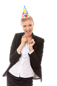 Portrait of a smiling young woman against white background